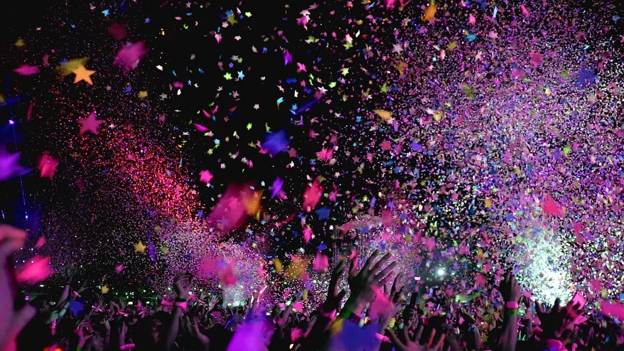 Confetti falling over a concert crowd