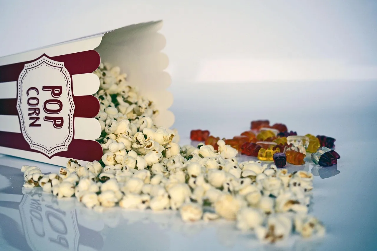 A box of popcorn spilling onto a table