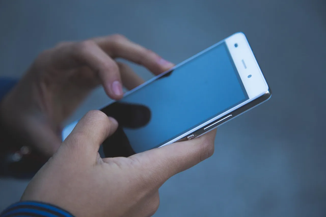 Hands using a smartphone