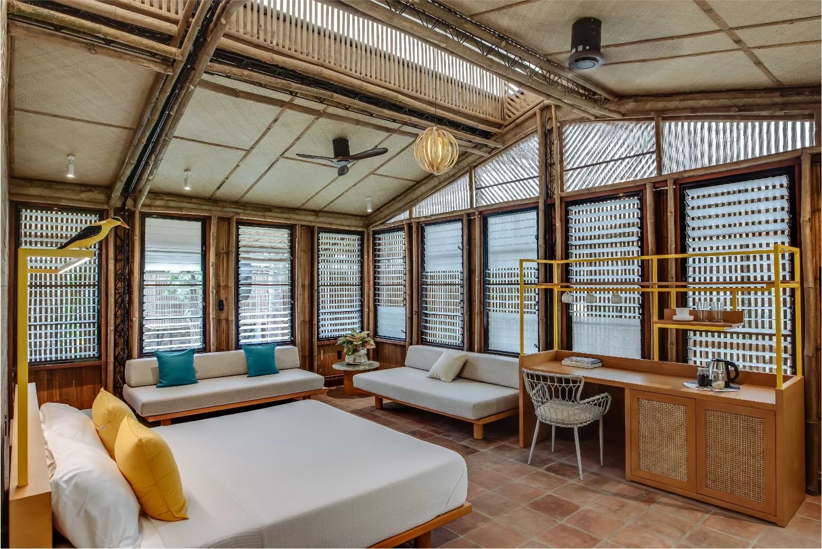 A guest cabin at Kilyawan Farm Resort with a woven bamboo ceiling and clay tile floor
