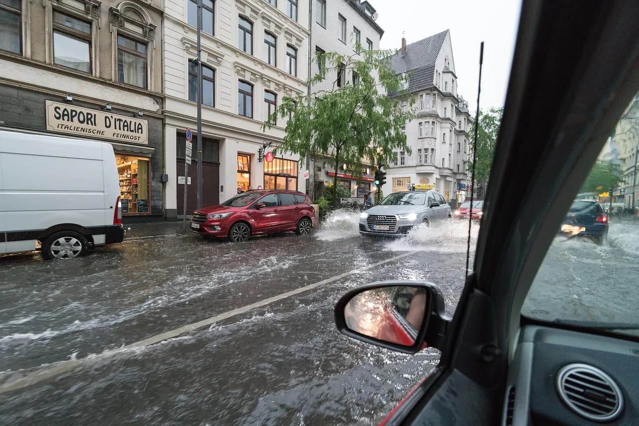 A flooded city street during heavy rain