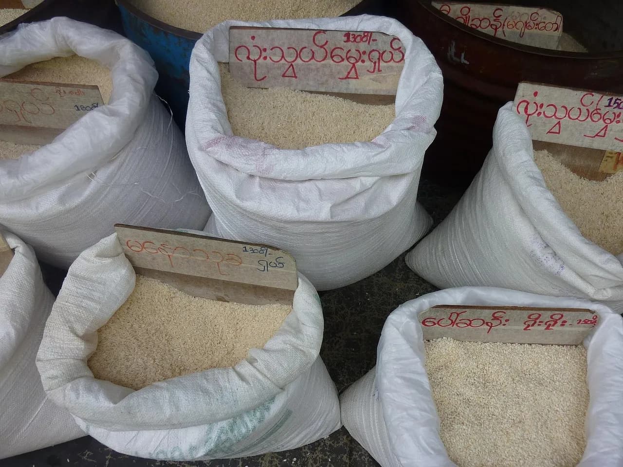 Open sacks of rice for sale at a market