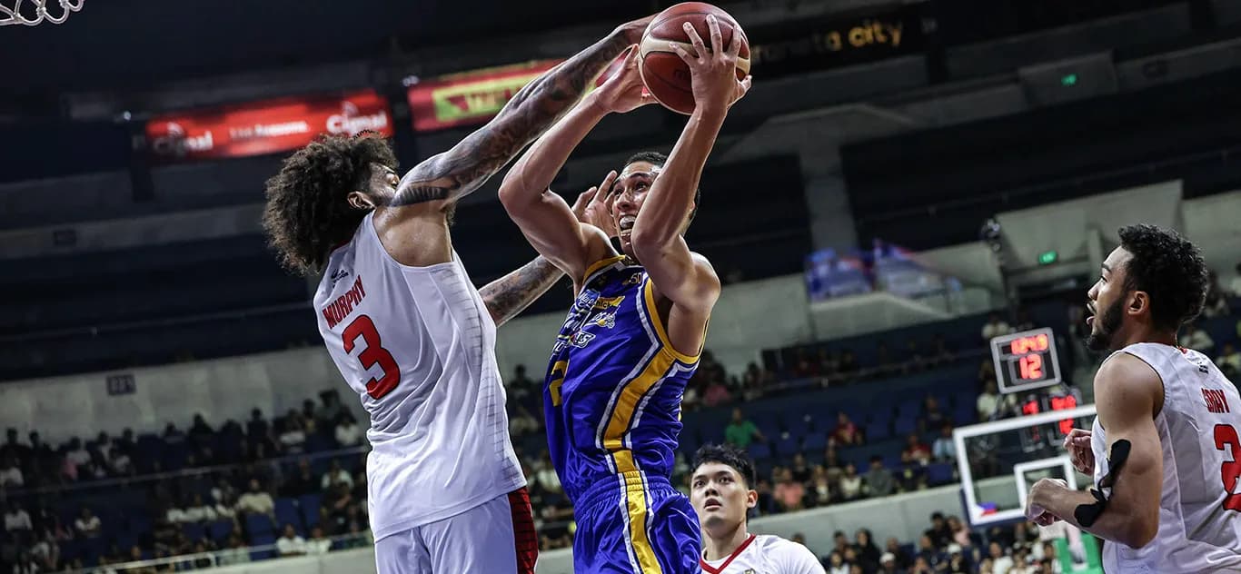 A Magnolia player goes up for a shot against Ginebra's Jordan Murphy