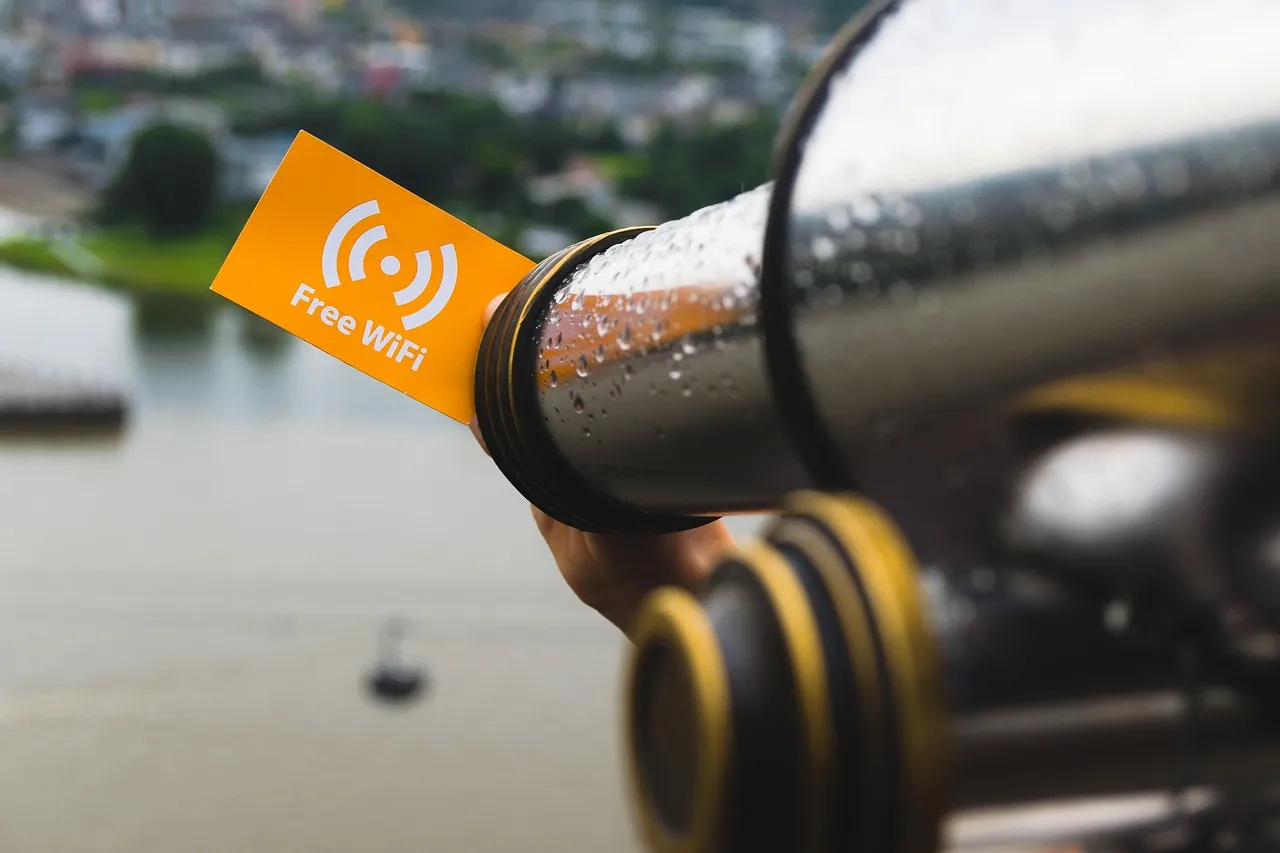 A free Wi-Fi sign on a pole by the water