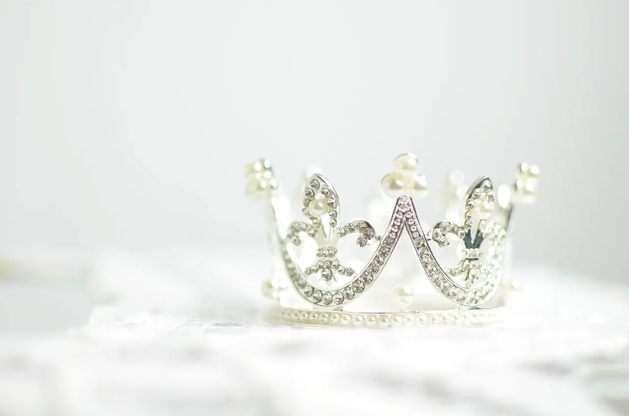 A crystal pageant crown on a white background