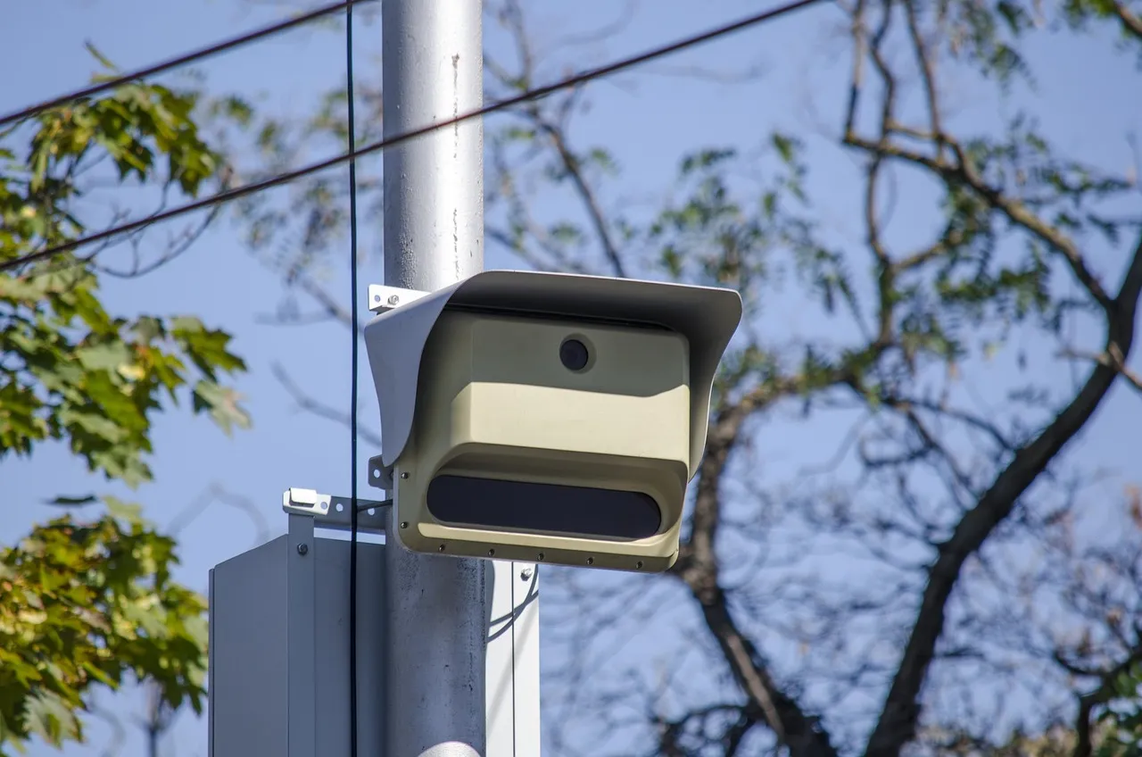 A roadside CCTV camera mounted on a pole