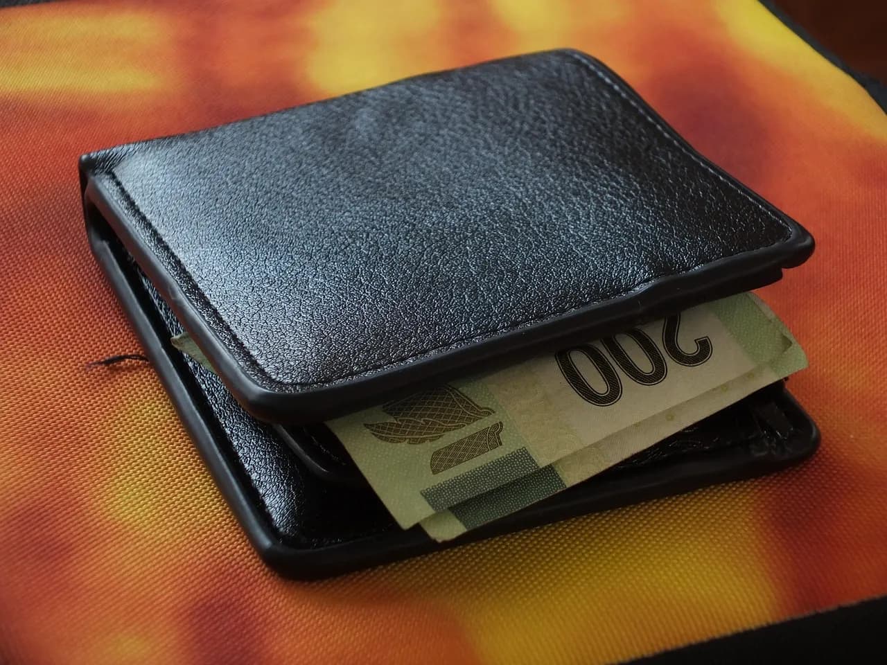 A leather wallet with a 200-peso bill