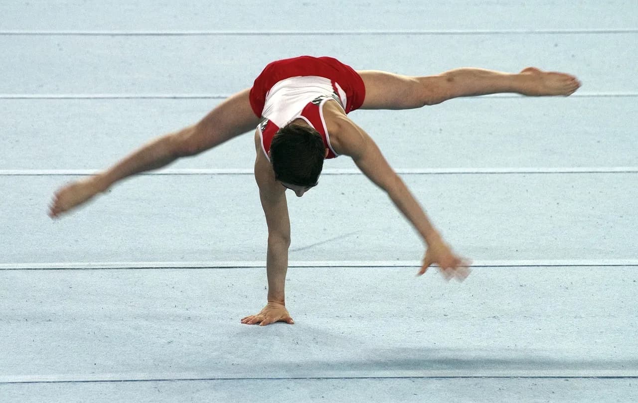 A gymnast performing on the floor